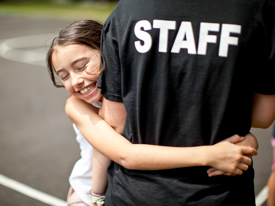 girl-hugging-staff